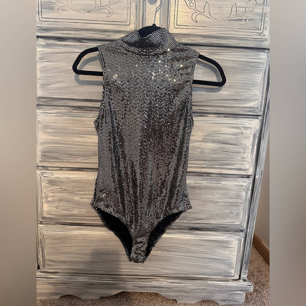 Silver bodysuit.